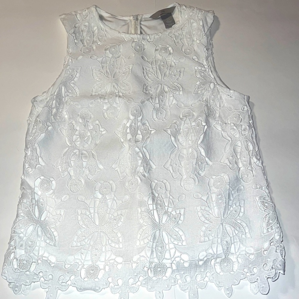 Gorgeous H&M white sleeveless blouse with white lining.